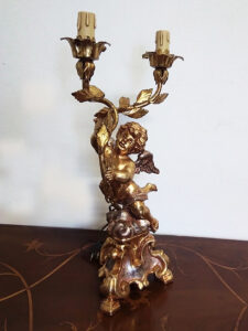 lampada putto oro due fiamme 