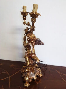 lampada putto oro due fiamme 