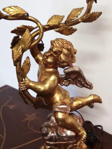 lampada putto oro due fiamme 